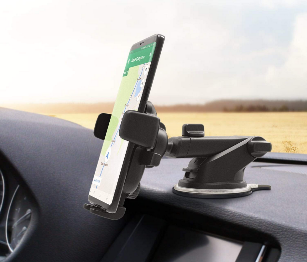 Smartphone mounted to car dash with adjustable suction mount