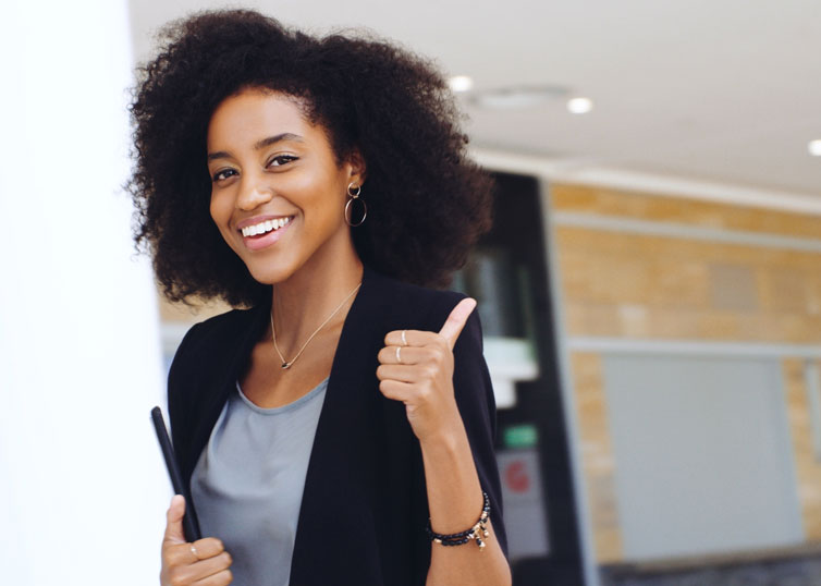 Real estate appraiser giving a thumbs up during the property inspection phase of the appraisal process